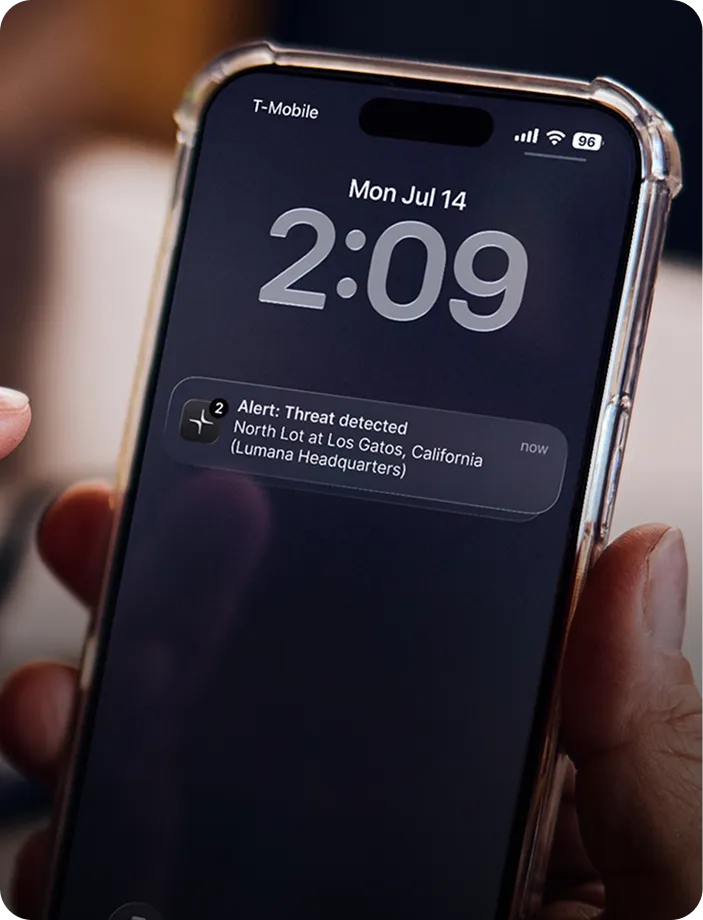 Smartphone screen showing a notification alert for a threat detected at North Lot in Los Gatos, California, with the time 2:09 and date Mon Jul 14.