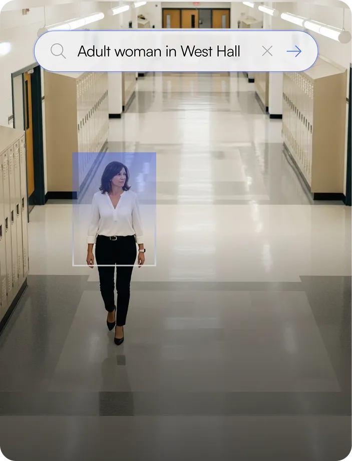 Adult woman walking down a school hallway lined with lockers, framed by a search box reading 'Adult woman in West Hall'.