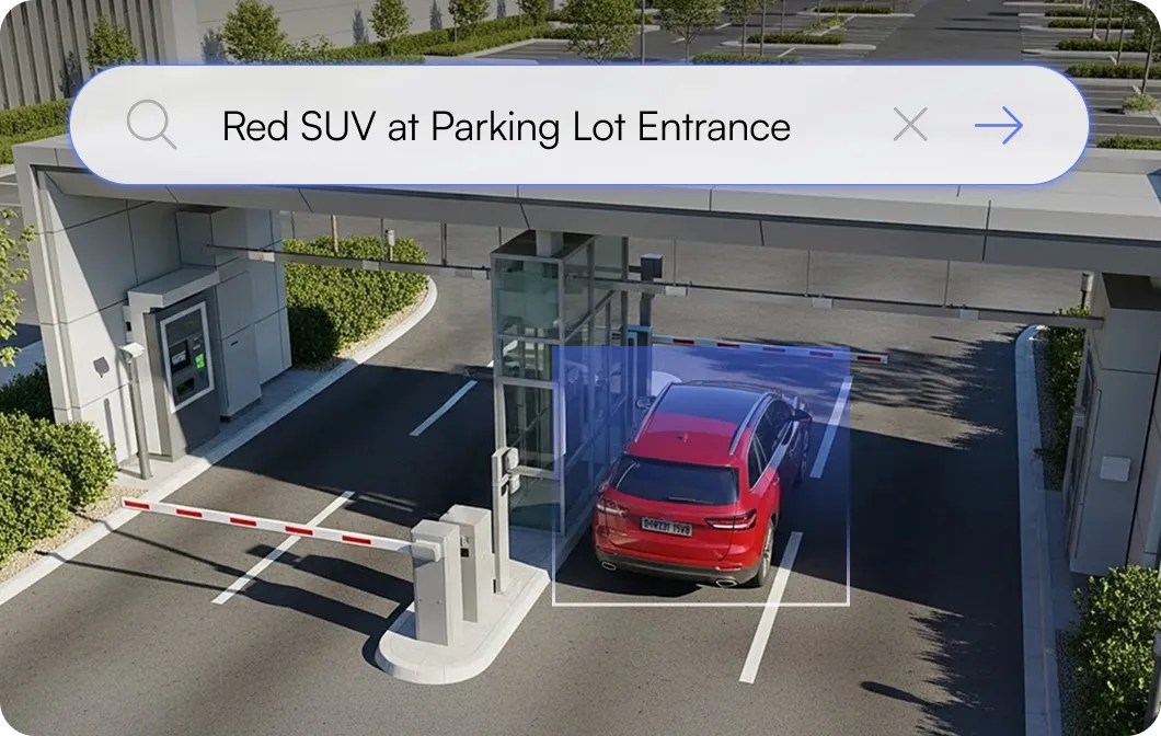 Red SUV parked at a parking lot entrance with a security gate and a barrier arm.
