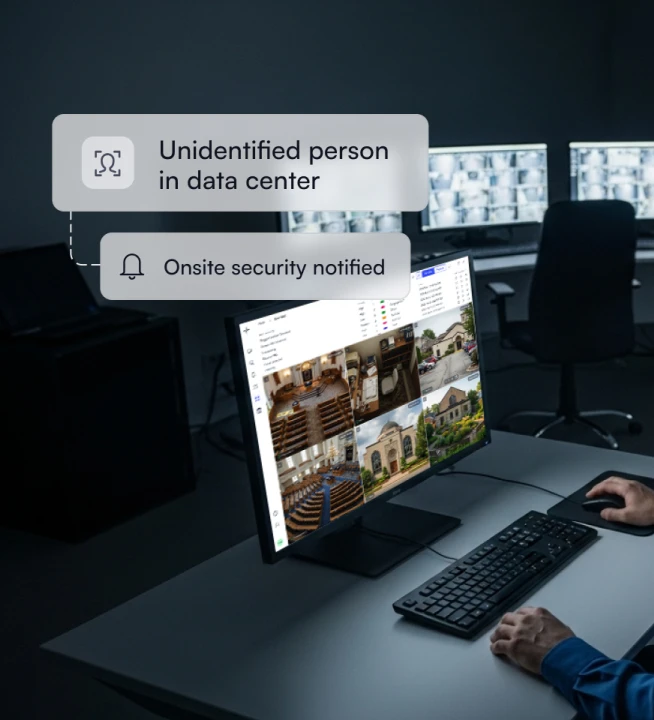 Computer screen displaying security camera feeds with notifications of an unidentified person detected in data center and onsite security notified.