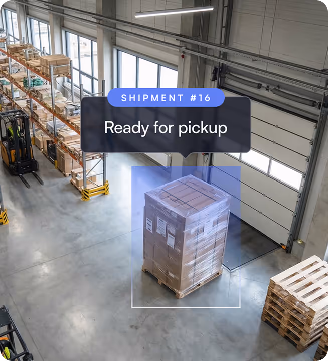 Warehouse interior with a pallet wrapped in plastic labeled Ready for pickup under Shipment #16 notification.