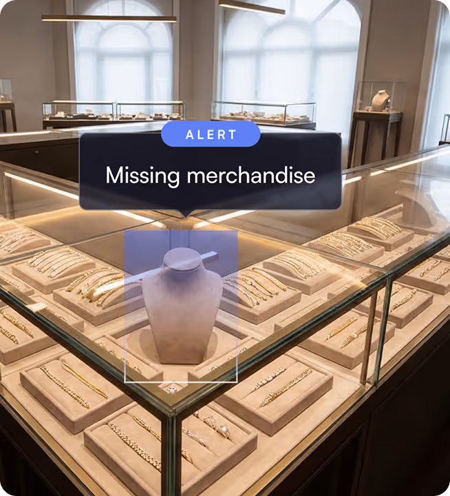 Jewelry display case in a store with empty necklace stand and alert box saying 'Missing merchandise'.