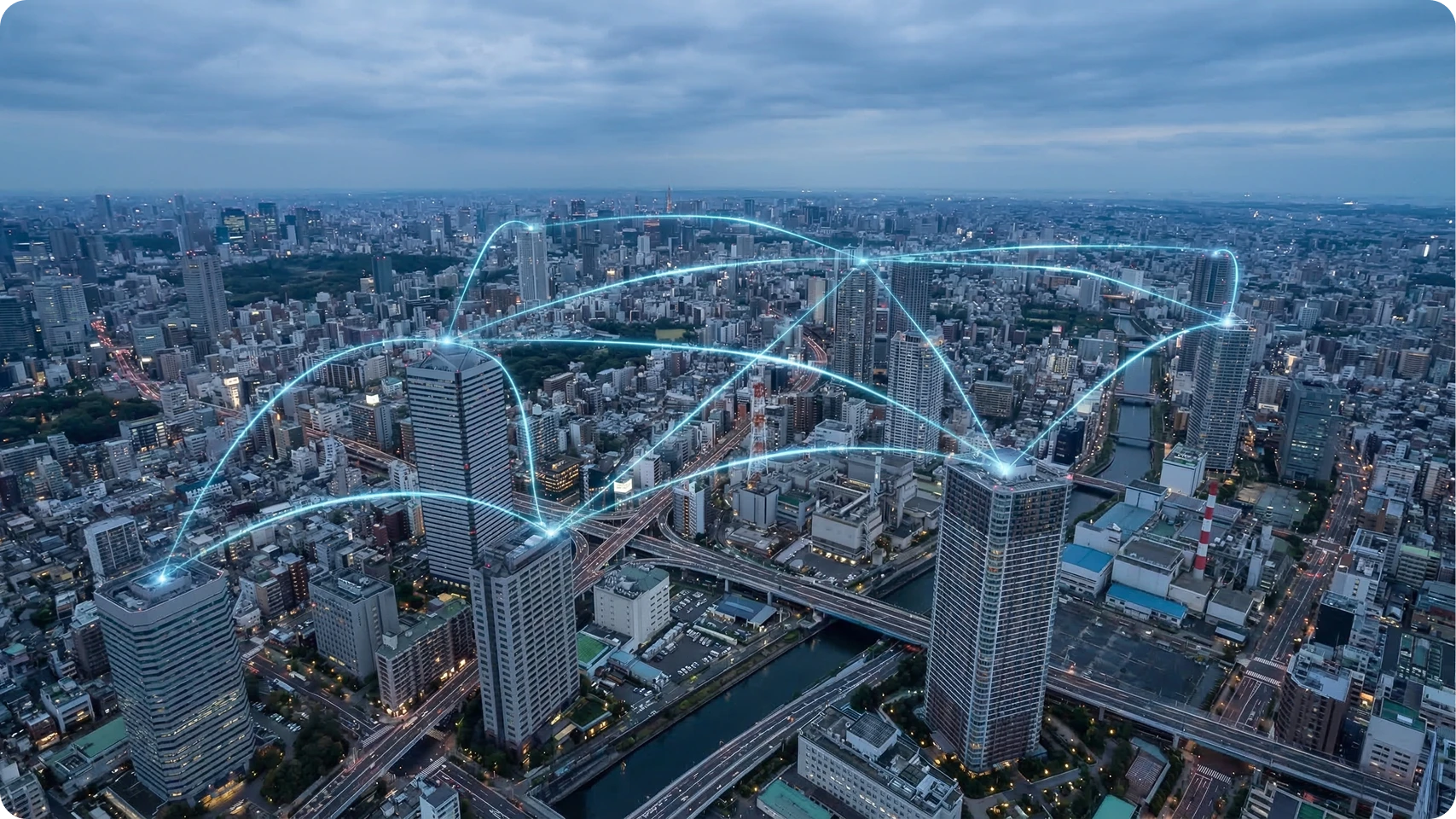Aerial view of a cityscape at dusk with digital light paths connecting multiple skyscrapers, representing network connectivity.