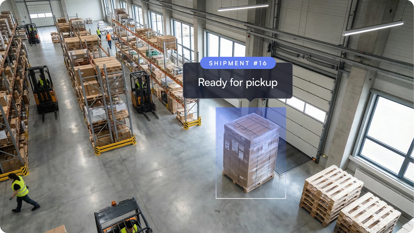 Warehouse interior with stacked pallets and forklifts, highlighting a wrapped shipment labeled 'Ready for pickup.'