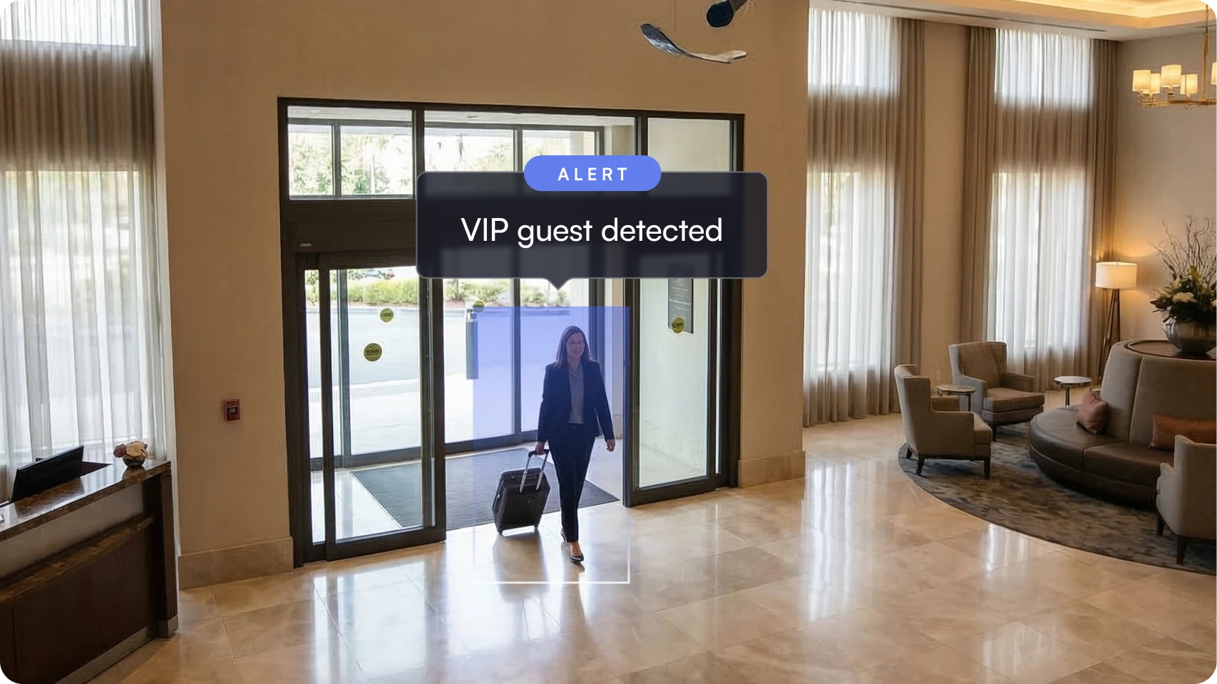 Woman walking through a hotel lobby with a suitcase and an alert overlay reading 'VIP guest detected.'