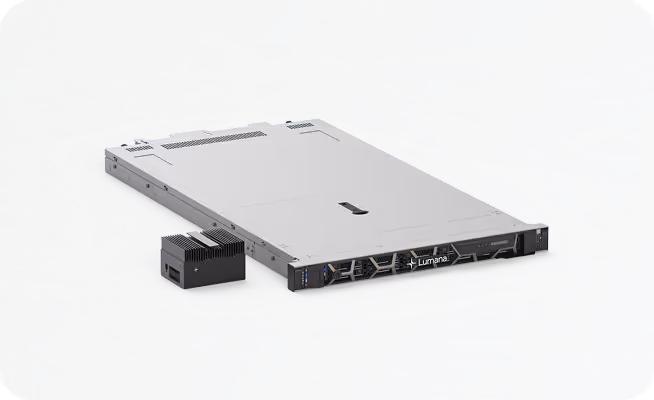 Luminary-branded thin, rectangular server unit and a smaller black electronic device placed beside it on a gray surface.