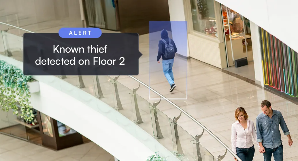 Mall corridor with alert showing known thief detected on Floor 2 near a man walking away wearing a hoodie and backpack.