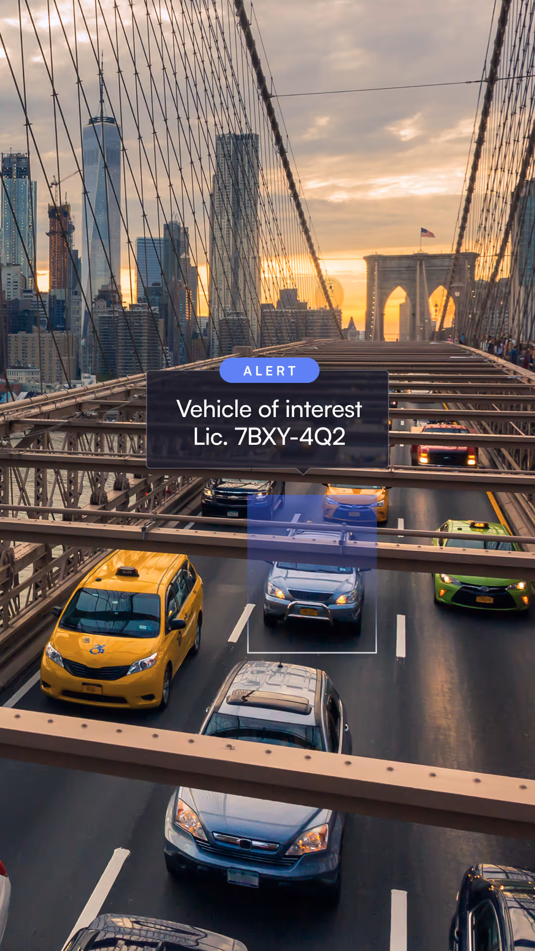 Traffic on Brooklyn Bridge at sunset with alert highlighting vehicle license plate 7BXY-4Q2.