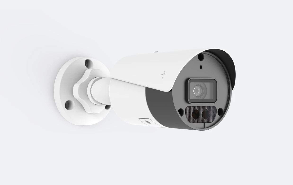 White wall-mounted outdoor security camera with a lens and sensor on a grey background.