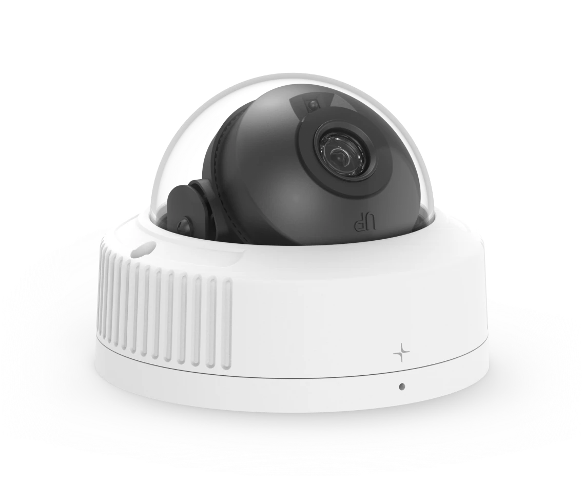 White dome security camera with a black lens inside a transparent cover.