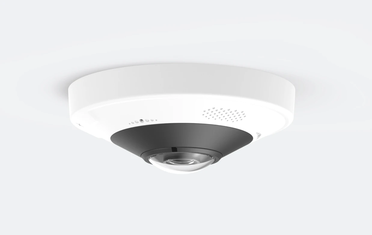 Ceiling-mounted fisheye security camera with white and black housing on a white background.