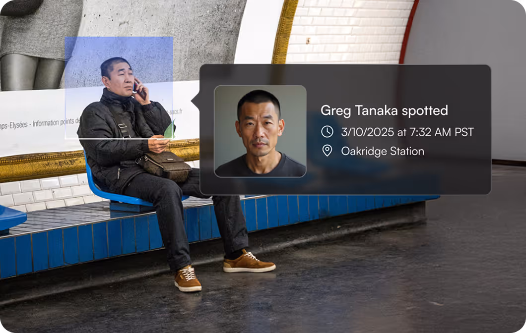 Man sitting on blue bench in station talking on phone with ID overlay showing Greg Tanaka spotted at Oakridge Station.