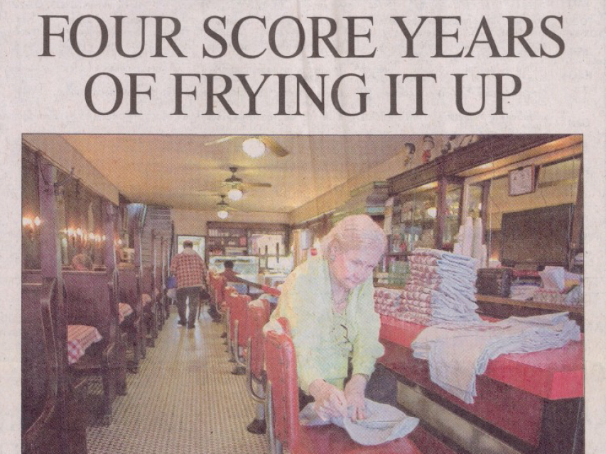 image of News and Observer newspaper article with headline Four Score Years of Frying it Up