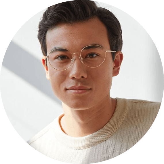 A man wearing glasses looking at the camera.