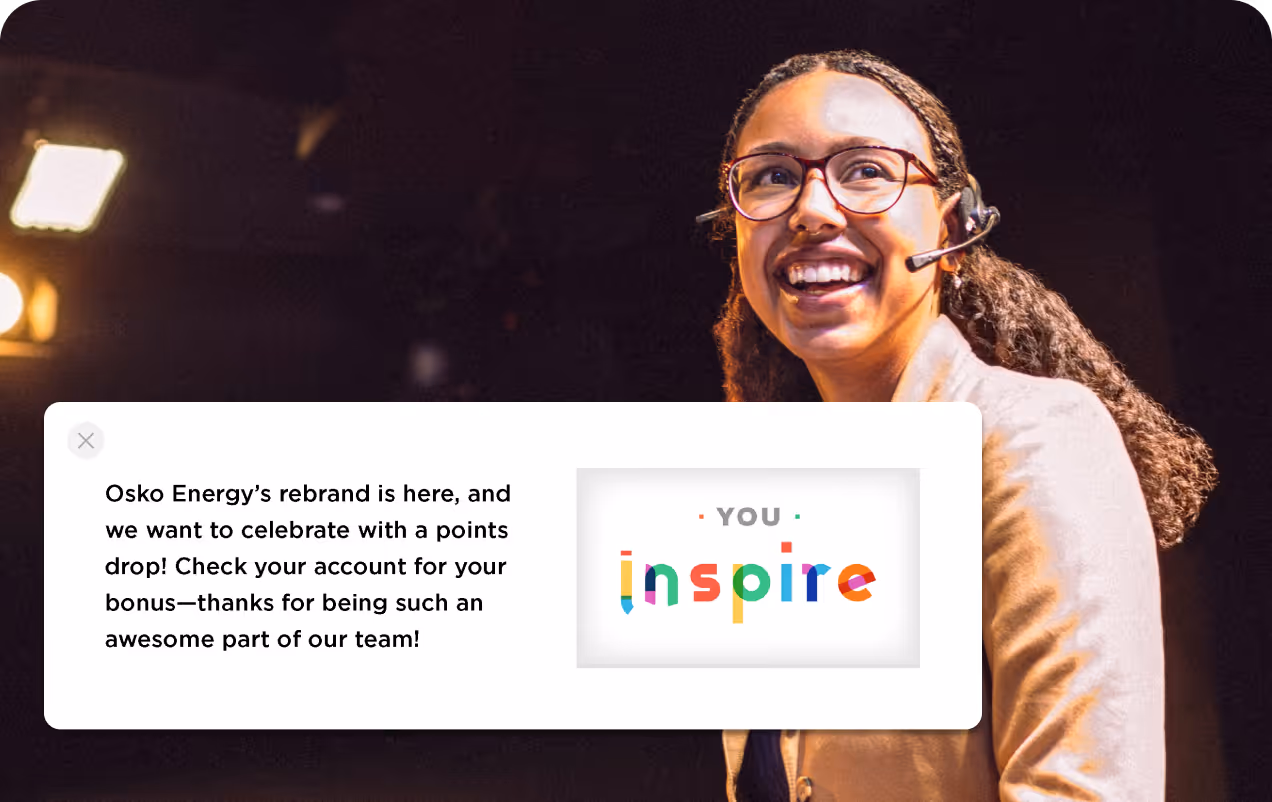 Smiling woman with glasses and a headset next to a message about Osko Energy's rebrand and points bonus, featuring colorful 'YOU inspire' text.