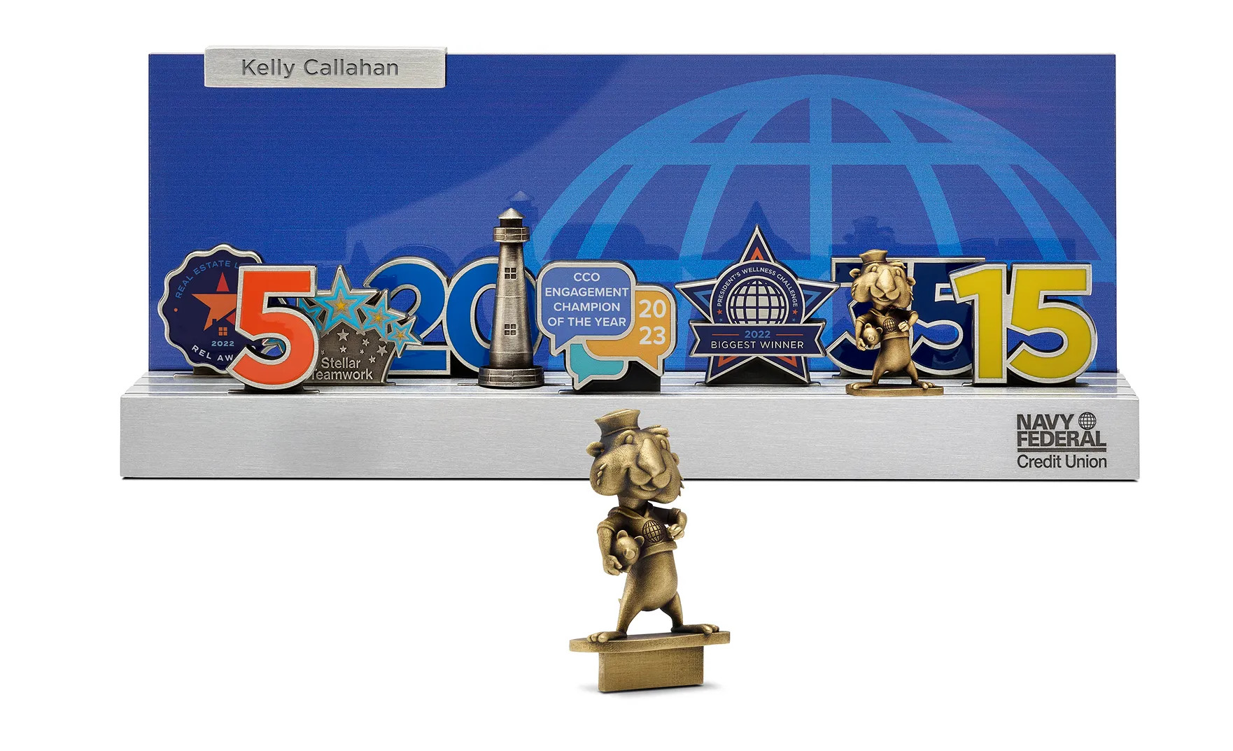 Navy Federal Credit Union award plaque with name Kelly Callahan featuring icons for engagement champion, teamwork, and wellness challenge achievements from 2022-2023.