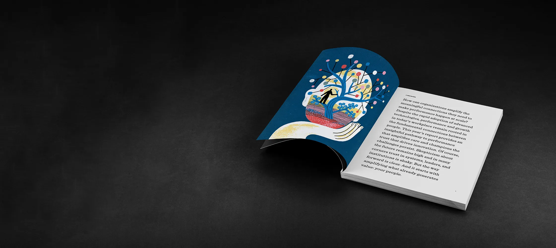 Open book on a dark surface showing a colorful illustration on one page and text about workplace culture change on the other.