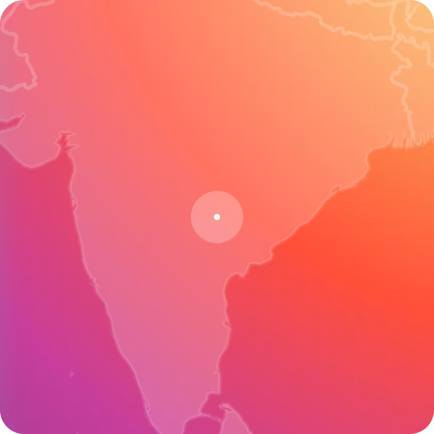 Stylized map of India with a central white dot marking a location, shaded with a gradient of pink, orange, and purple colors.