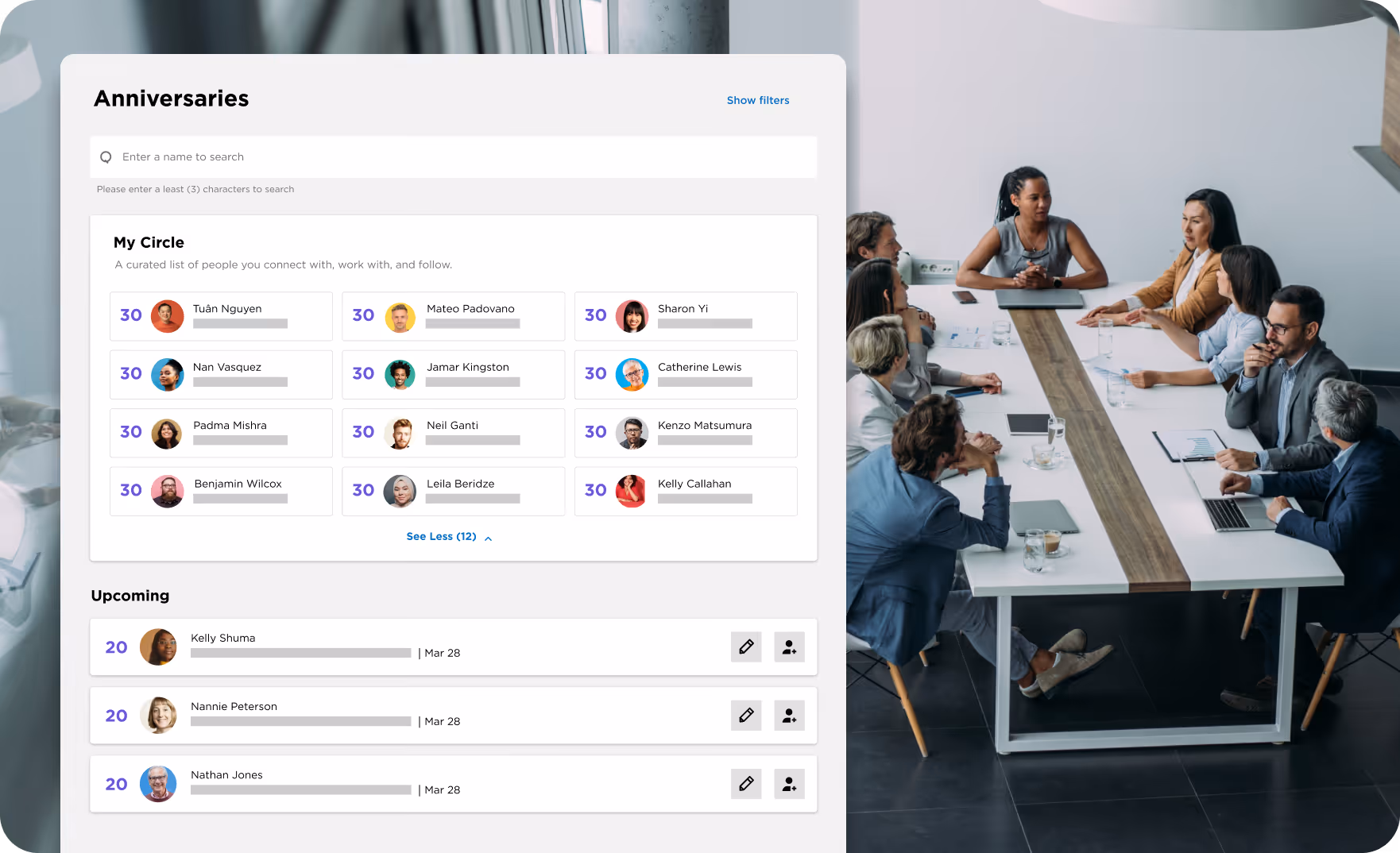 A diverse group of professionals seated around a conference table engaged in a meeting, with a digital screen displaying an employee anniversaries dashboard on the left.