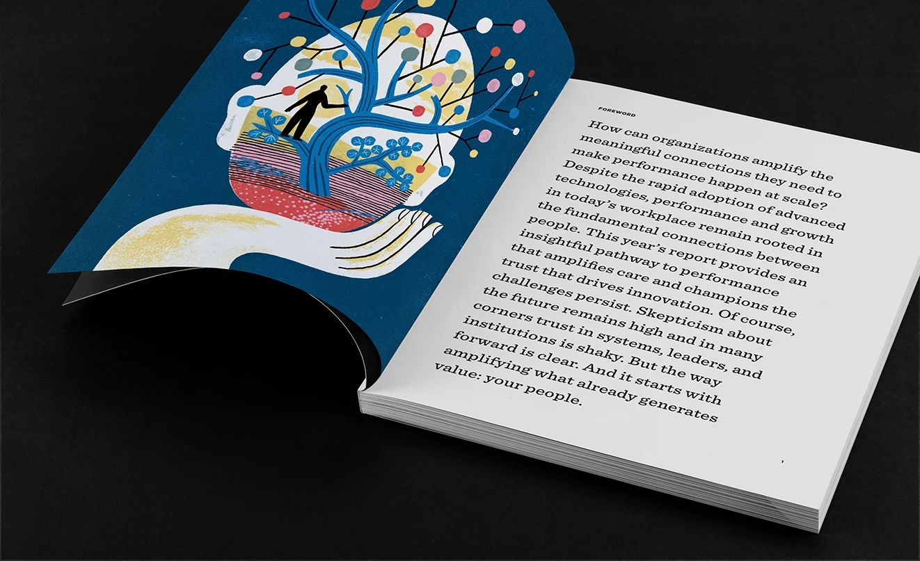 Open book with an illustrated page showing people and a page of text discussing workplace culture changes and fostering inclusion.