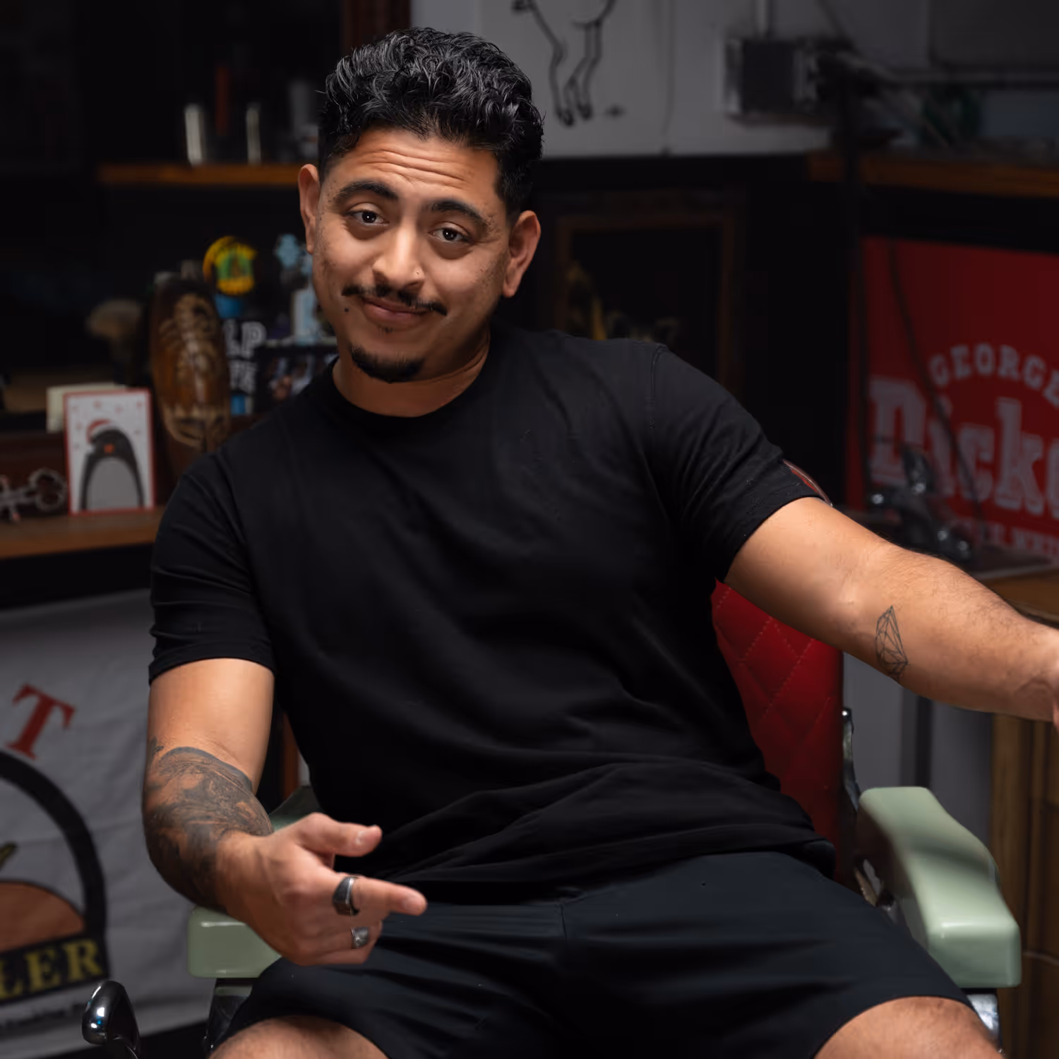 Emmanuel sitting in his barber chair