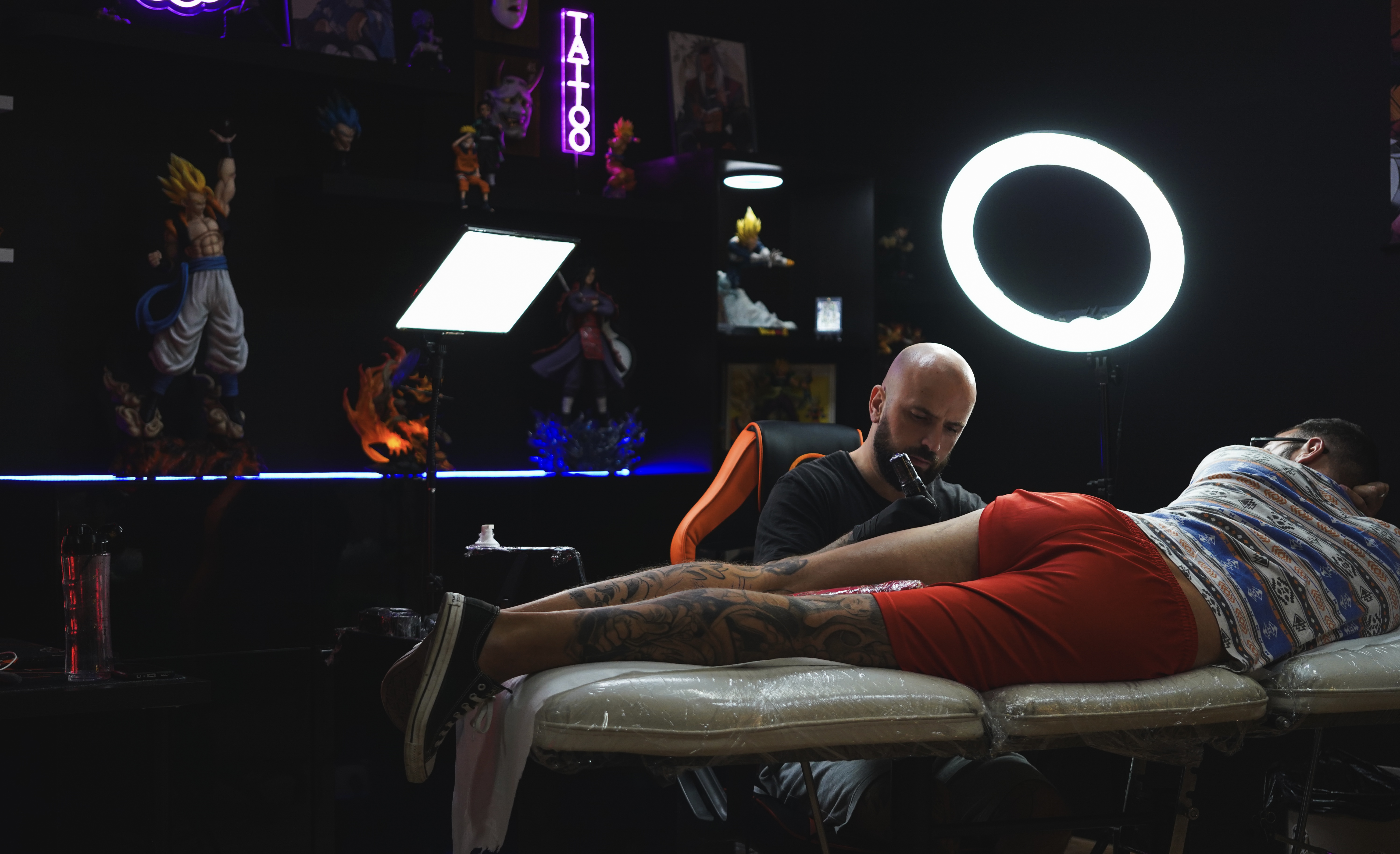 image of artist creating a tattoo