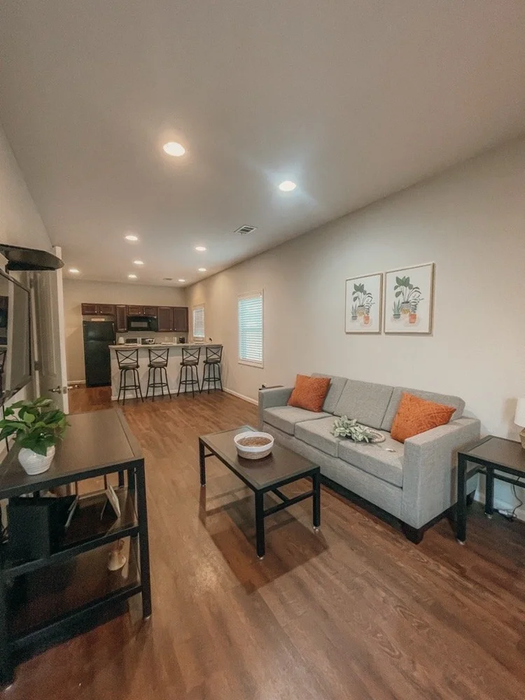 living area with tv and sofas