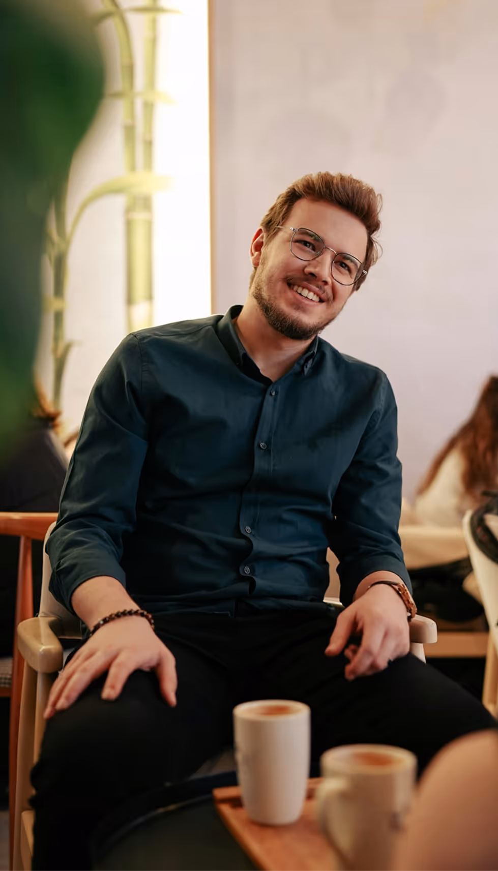Man sitting and smiling.