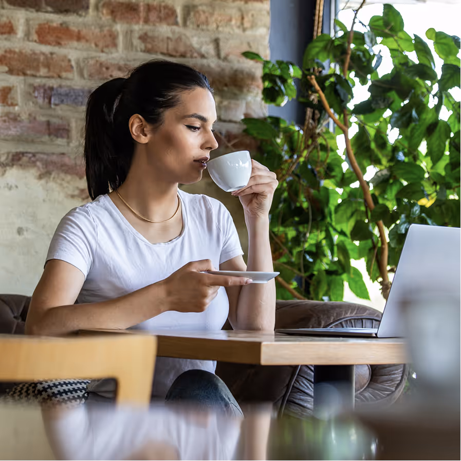 Woman drinking coffee.
