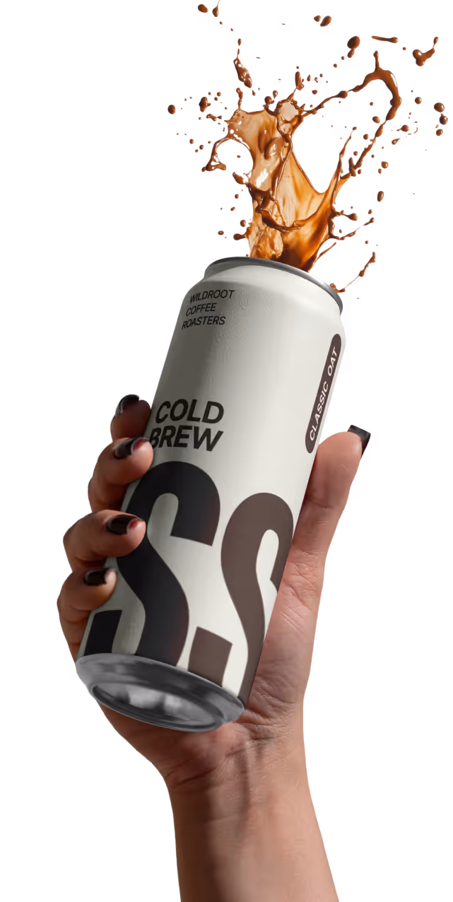 hand holding stone sip cold brew can with coffee splashing upward in dynamic motion
