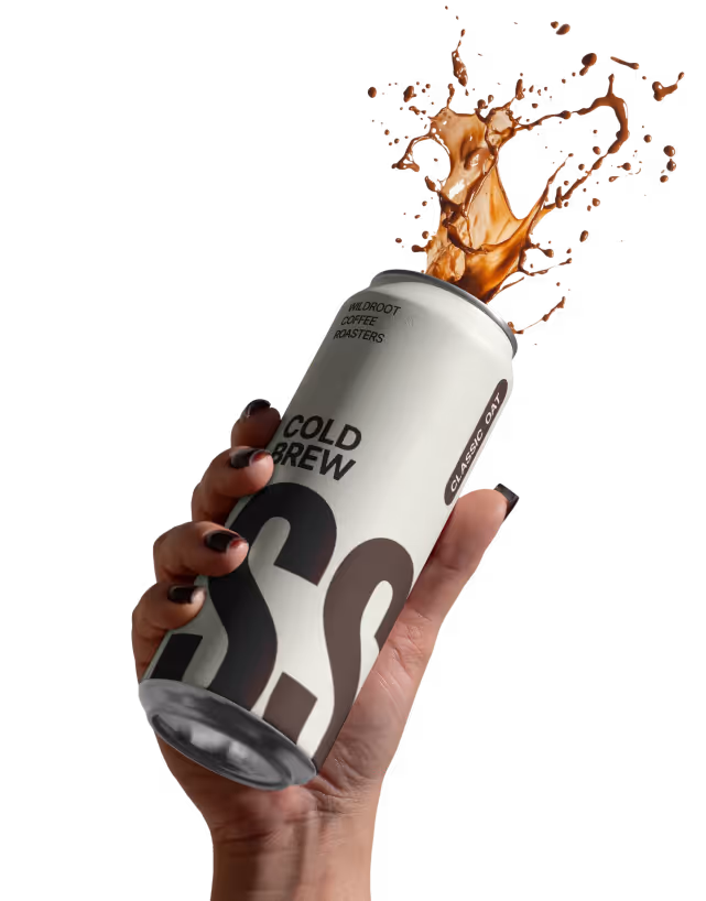 Hand holding can with coffee splash.