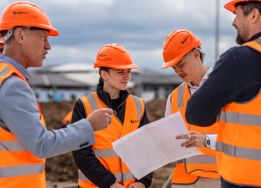 inclusive team on construction site having a meeting