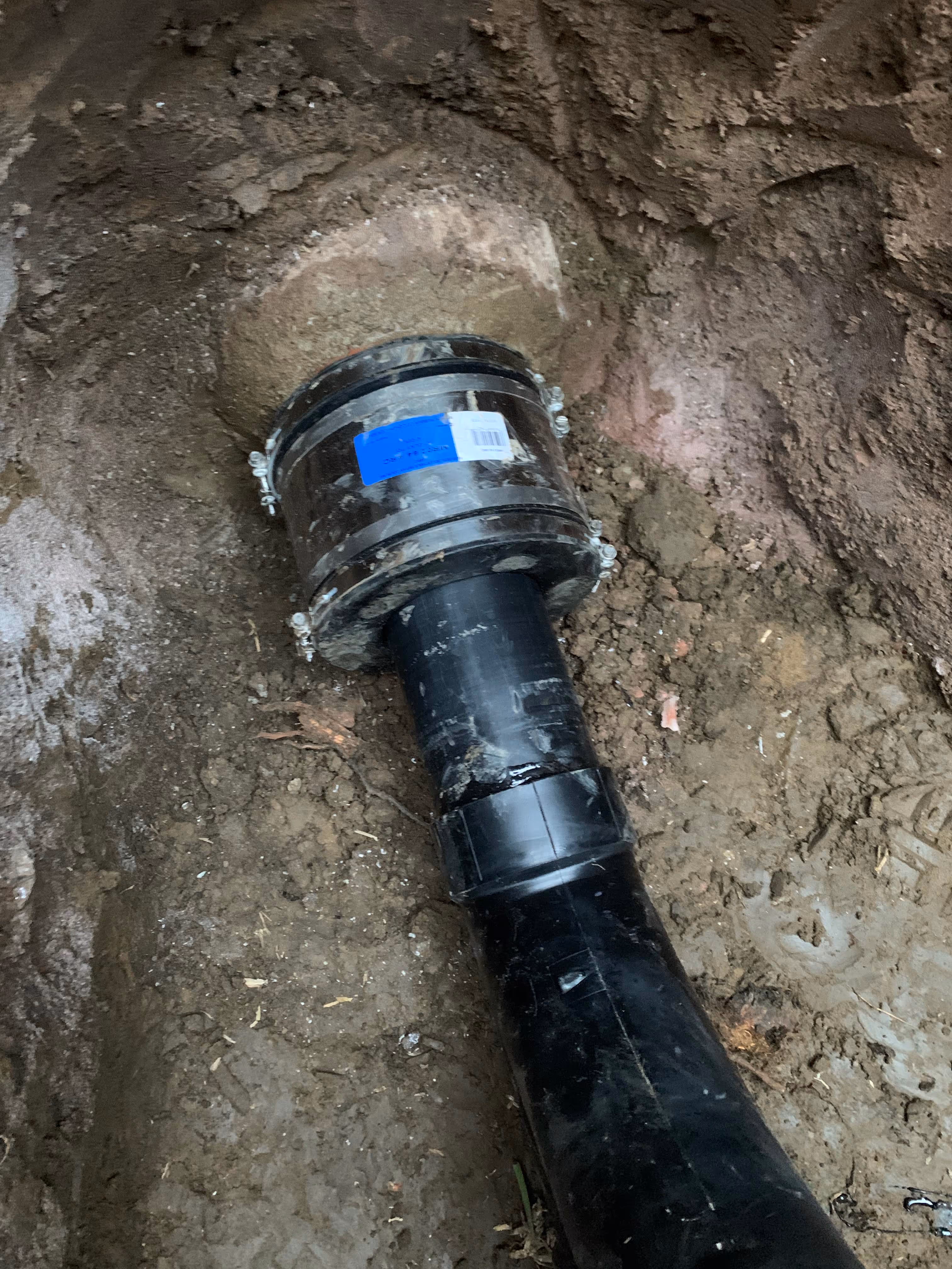 Image of a sewer Line repair inside a deep trench