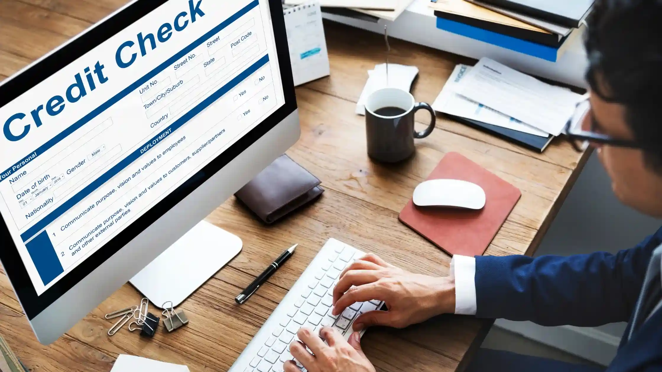 Man on computer showing why do lenders do credit check..