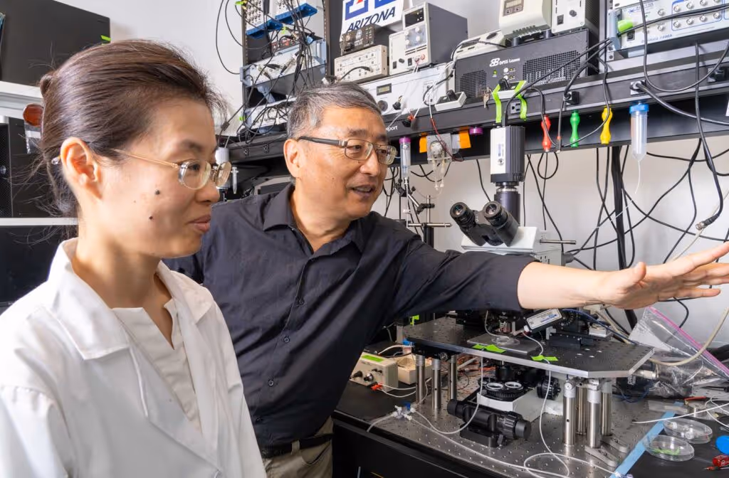 Shenfeng Qiu, PhD (right) and Jing Wei, a research scientist, in the lab.