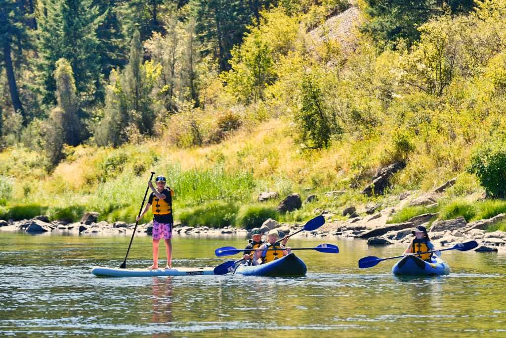 Family kayaking together in Montana