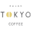 Logo with the text 'drama TOKYO CAFE' in stylized black letters on a white background.
