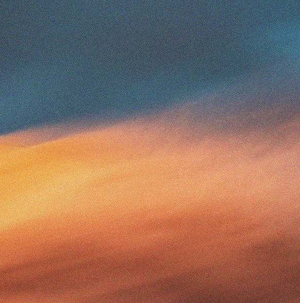 Sky with colorful clouds during sunset or sunrise, showing shades of blue, orange, and pink.