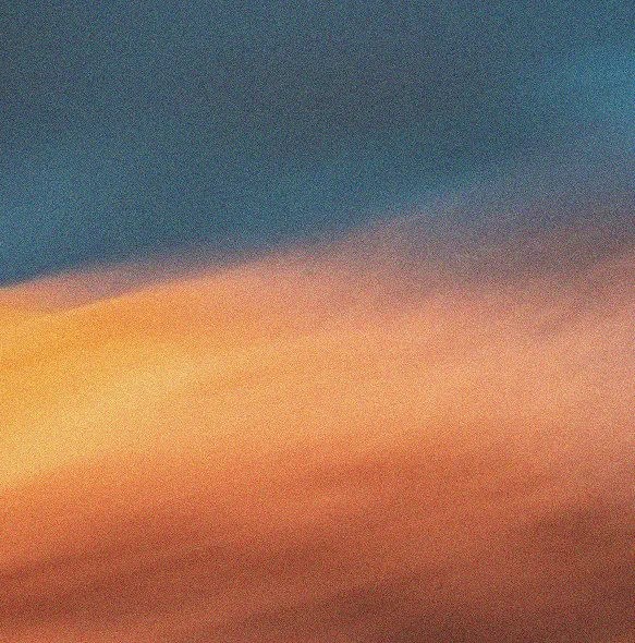 Sky with colorful clouds during sunset or sunrise, showing shades of blue, orange, and pink.
