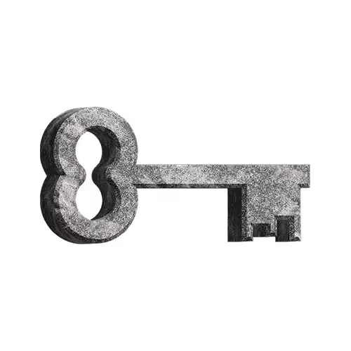 Old-fashioned metallic skeleton key with a round bow and intricate notches.