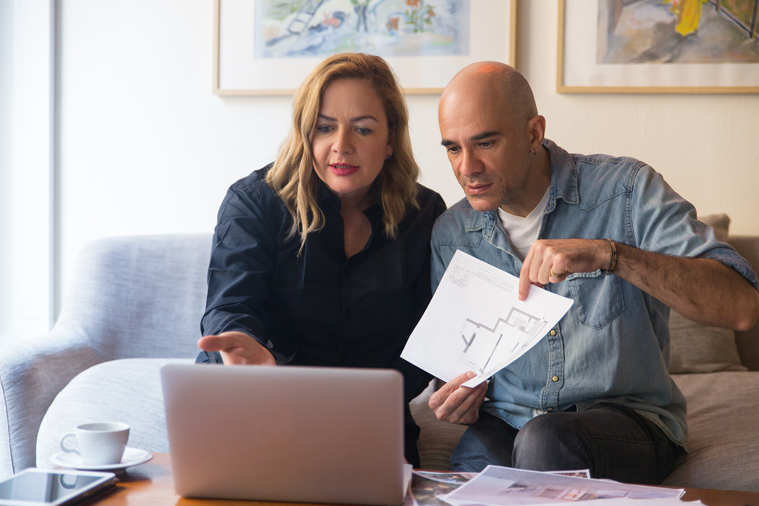 Couple reviewing documents at home