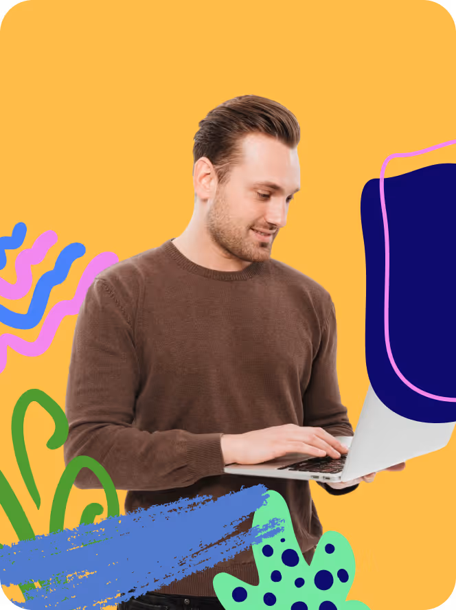 Man wearing a brown sweater using a laptop against a yellow background with colorful abstract shapes.