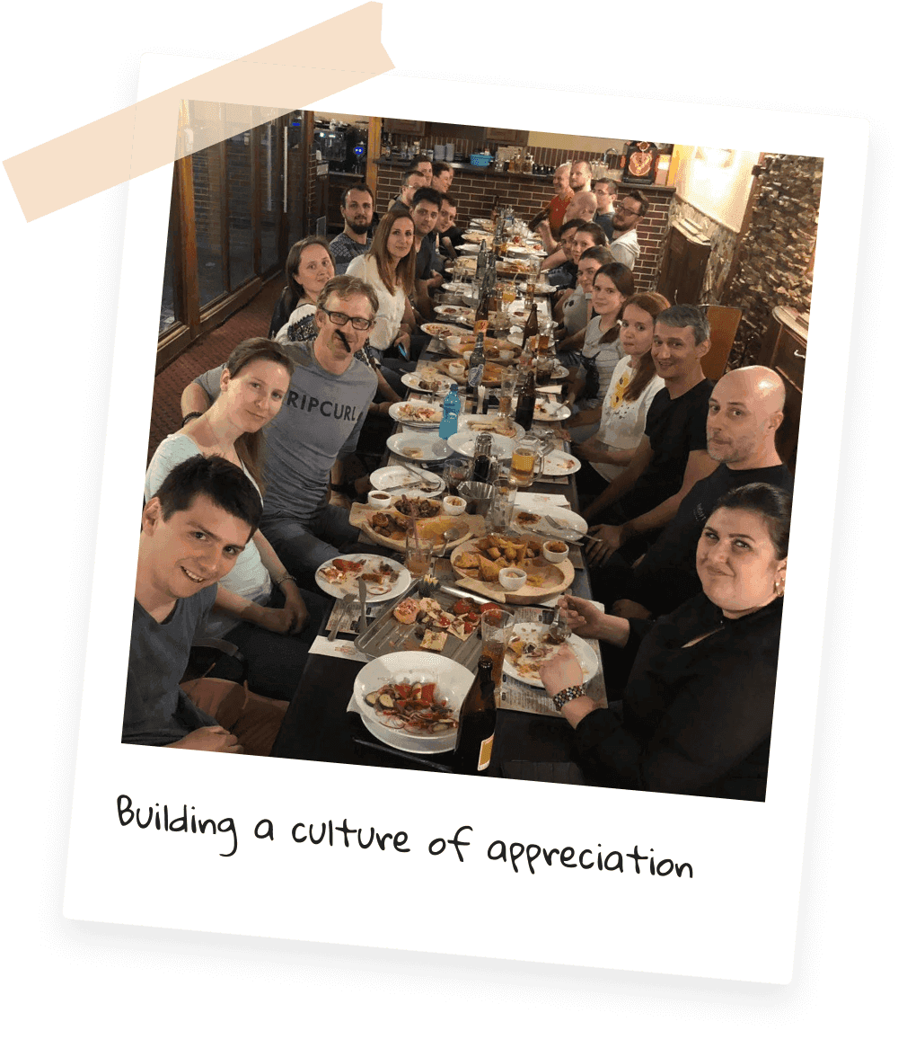 Lucen Software team gathered around a dinner table at a team event, captioned Building a culture of appreciation