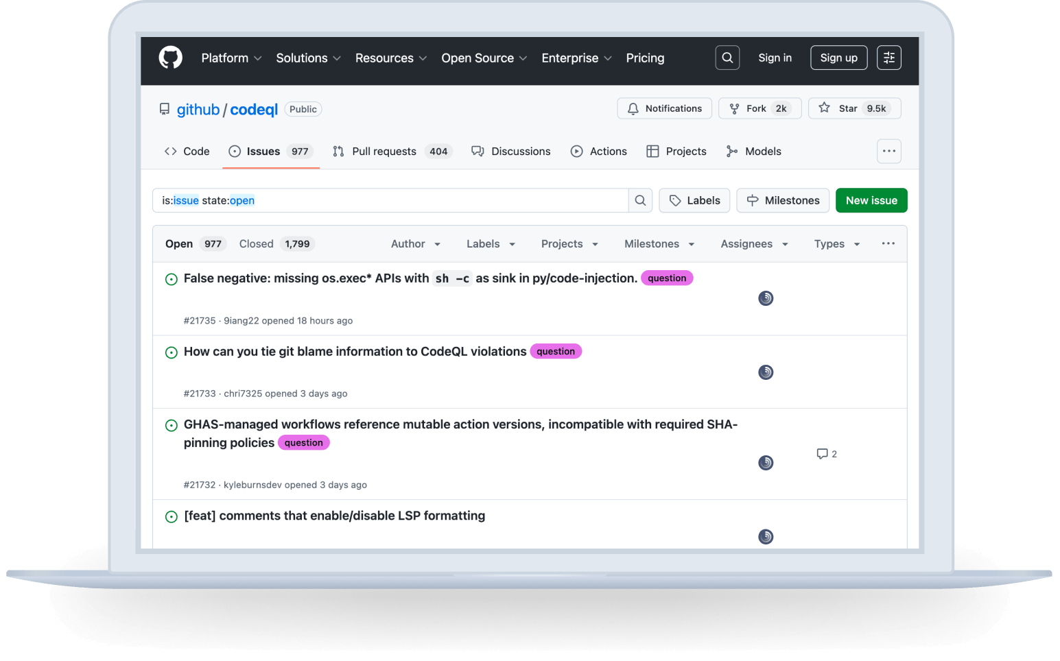 A laptop with a GitHub dashboard showing issues and the Track button next to the issues