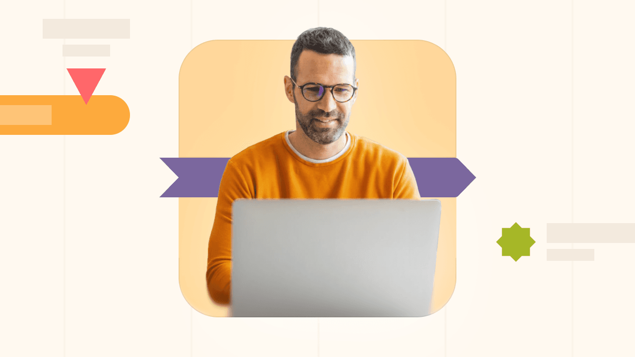 Man wearing glasses and orange shirt working on a laptop with abstract shapes in background.