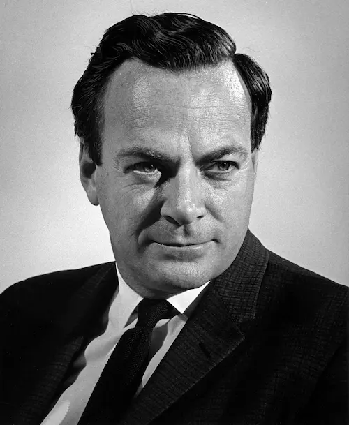 Black and white portrait of a man in a suit and tie with neatly combed hair looking slightly to the side.