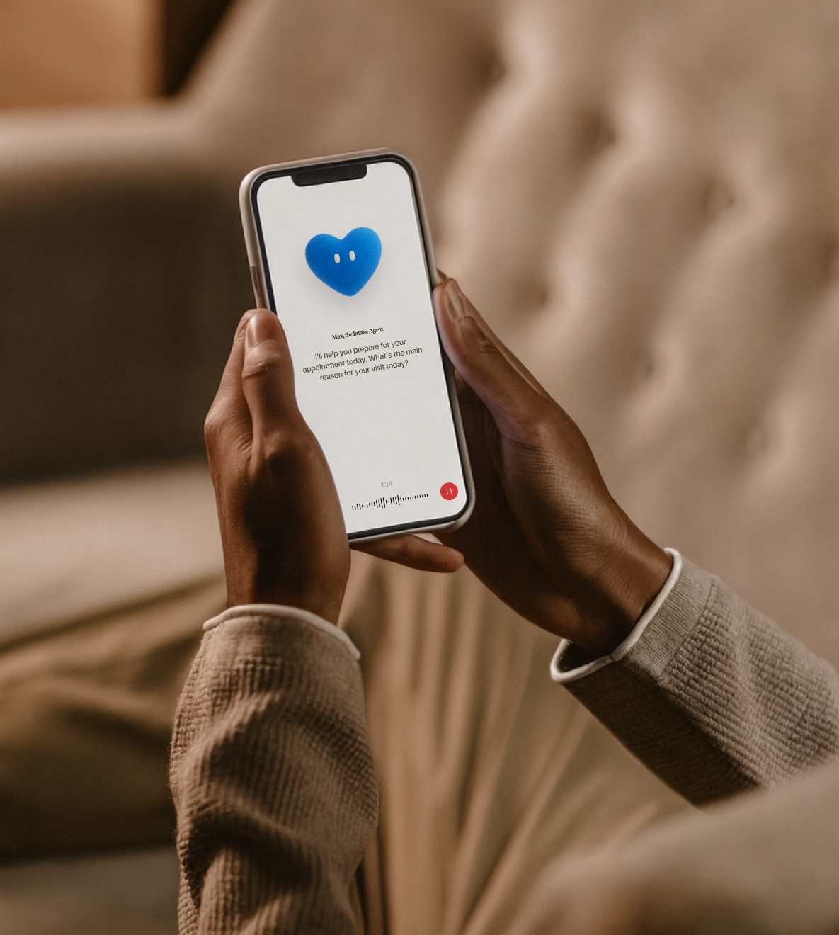 Person holding a smartphone displaying a virtual assistant with a blue heart icon and a message about preparing for an appointment.