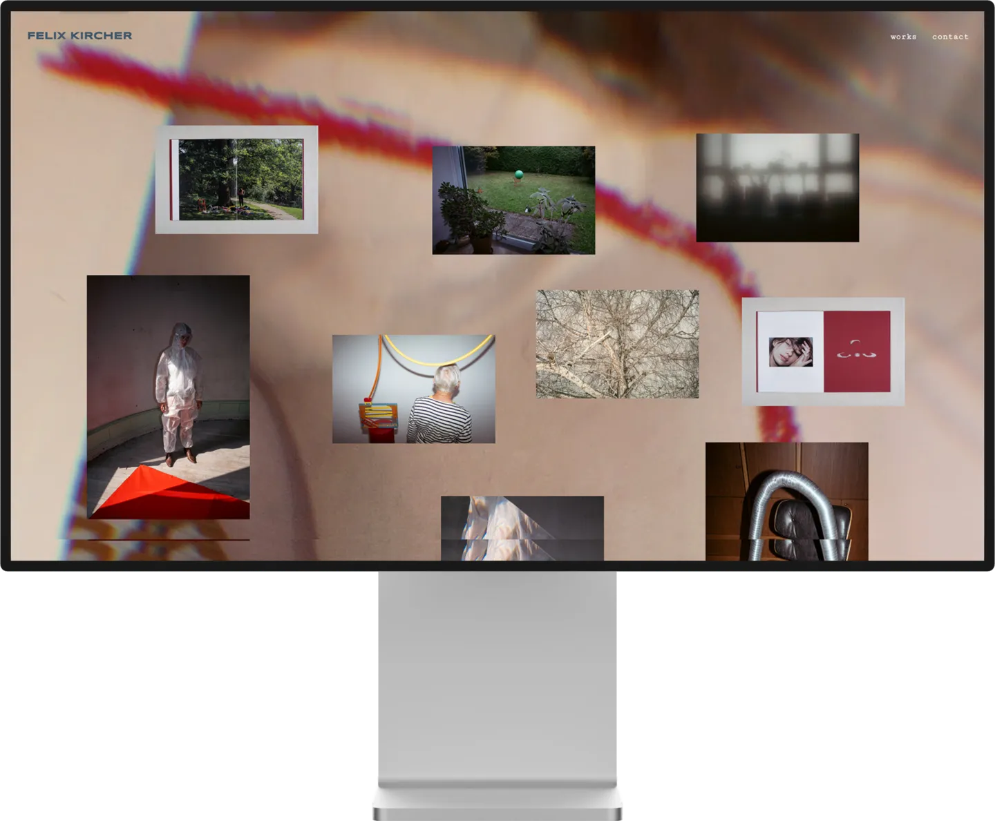 Computer screen showing a portfolio webpage with various artistic photos and the name Felix Kircher.