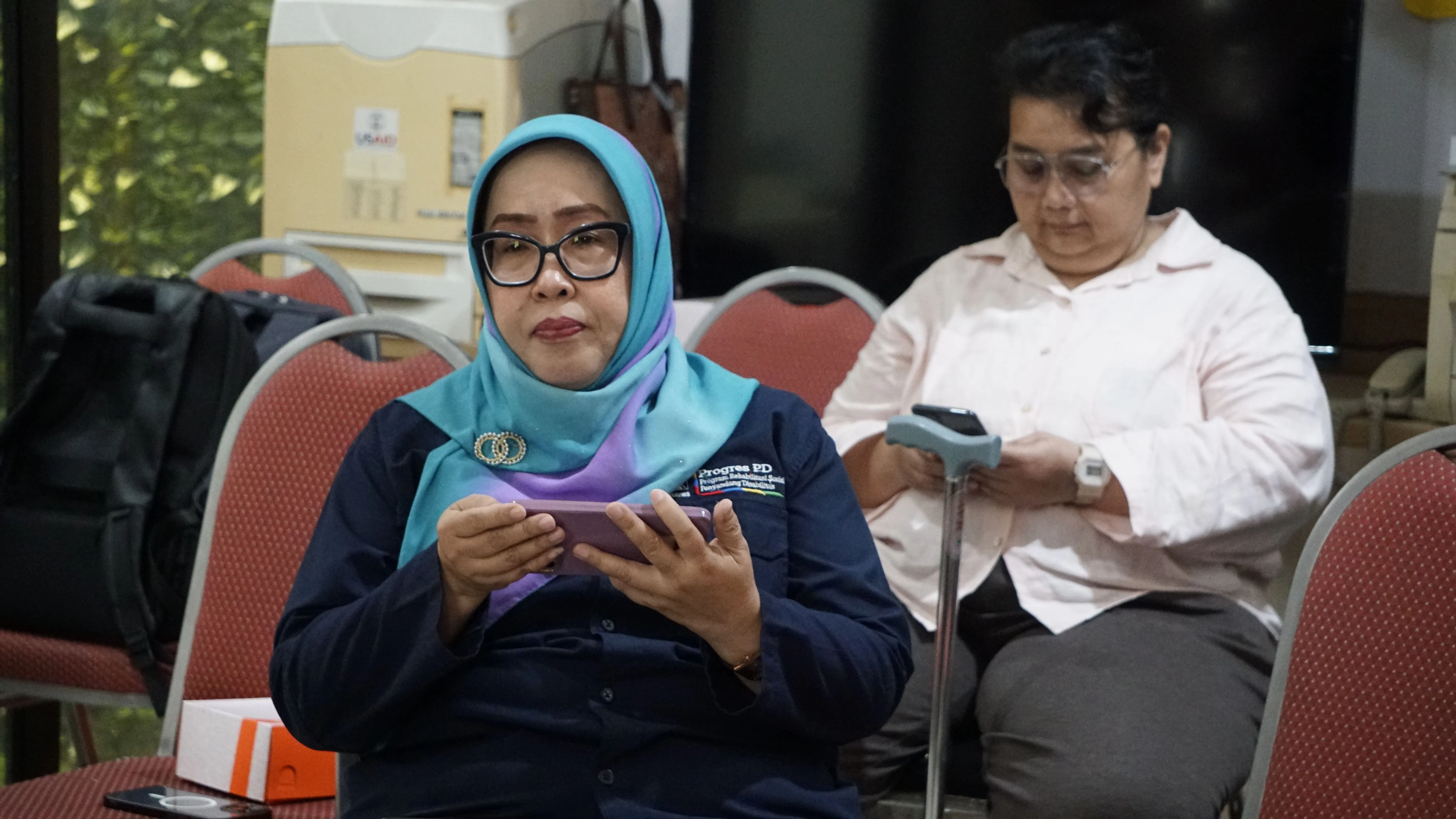 Two Indonesian women with disabilities in their OPD