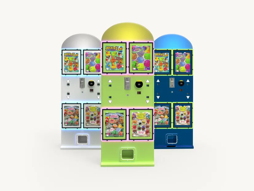Three colorful vending machines in white, green, and blue, each displaying images of collectible toy capsules.